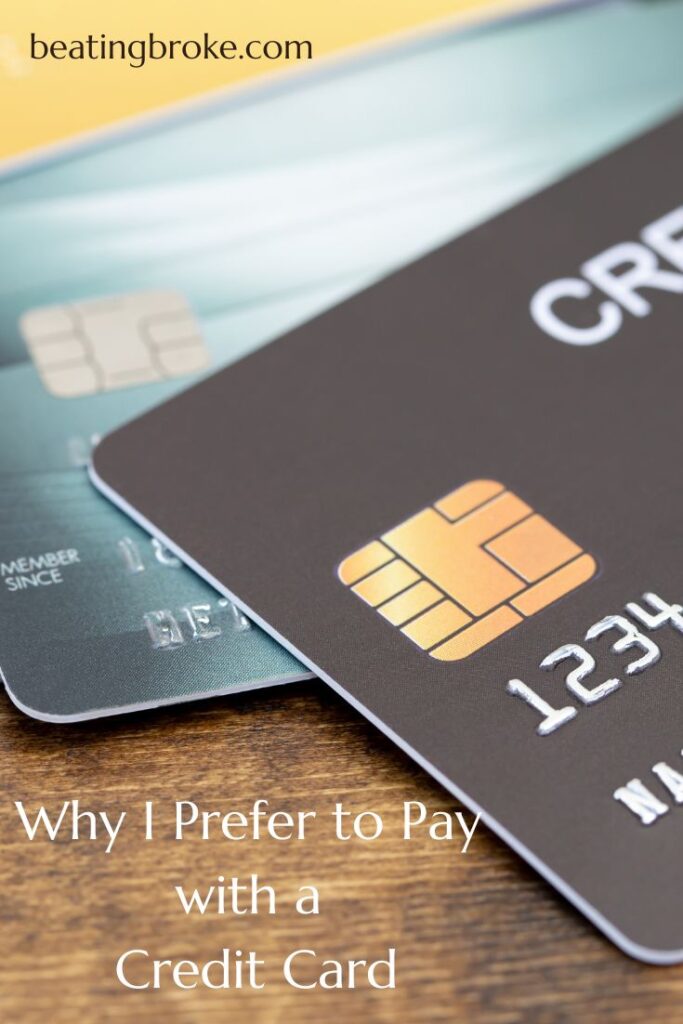 Two credit cards sitting on a table