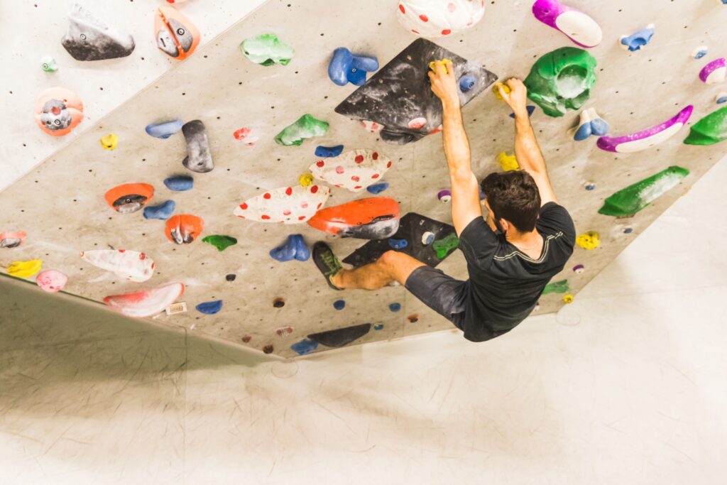 Man climbing at an indoor rock climbing location